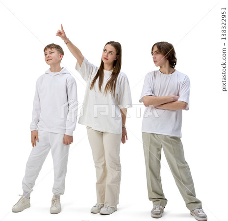 Teenagers pointing upward showing direction isolated white background 138322951