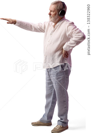 Senior man wearing headphones pointing forward isolated on white background 138322960