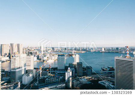 The urban landscape of the bay area, with Tokyo Bay and a cluster of skyscrapers stretching out before you. The urban landscape of the bay area, with Tokyo Bay and a cluster of skyscrapers stretching out before you. 138323169