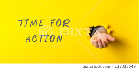 Hand emerging from a torn yellow paper background, symbolizing opportunity and motivation, with bold text stating "Time for Action" emphasizing urgency and determination 138323549