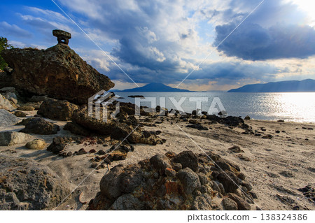 A view of Sakurajima and the rocky coastline from Kurokawa Cape. A view of Sakurajima and the rocky coastline from Kurokawa Cape. 138324386