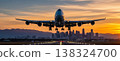 Large Passenger Airplane on Runway Against Sunset City Skyline 138324700