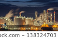 Night View of a Vast Oil Refinery with Docked Ships 138324703