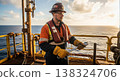 Worker on Offshore Rig with Wrenches at Sunset 138324706