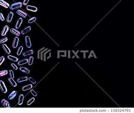 A 3D rendered background image featuring transparent neon-colored capsules floating against a black background, with ample copy space on the right. A 3D rendered background image featuring transparent neon-colored capsules floating against a black background, with ample copy space on the right. 138324791