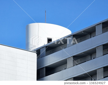 Minimal modern architecture with clear blue sky background. 138324927