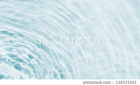 Light blue background with ripples on the water's surface. 138325201