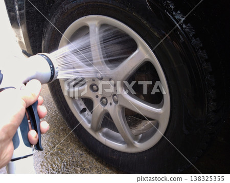 Image of rinsing off antifreeze 138325355