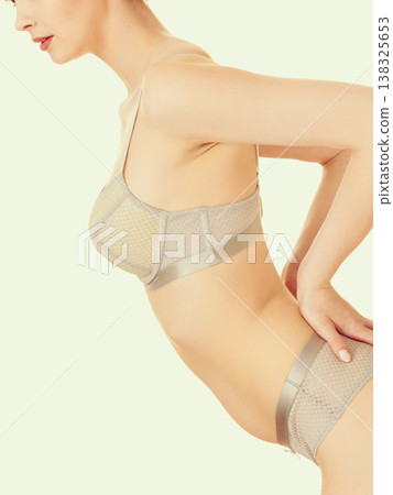 Attractive slim woman in grey matching underwear Attractive slim woman in grey matching underwear 138325653