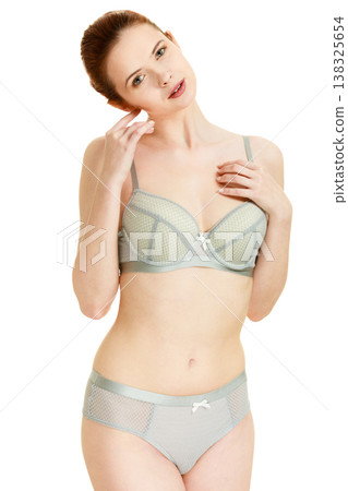 Attractive slim woman in grey matching underwear Attractive slim woman in grey matching underwear 138325654