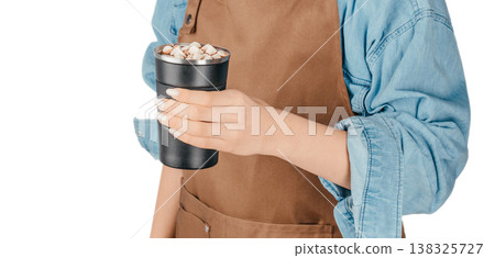 Barista holding hot chocolate in reusable cup 138325727