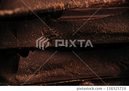 Chocolate bars macro background with dark textured surface 138325728