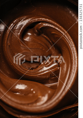 Melted chocolate swirl texture vertical Melted chocolate swirl texture vertical 138325731