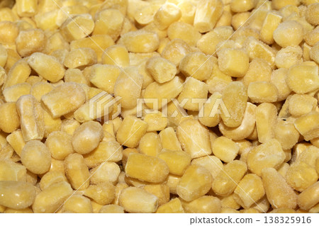 Cose up of frozen sweetcorn corn kernels yellow seeds background Cose up of frozen sweetcorn corn kernels yellow seeds background 138325916