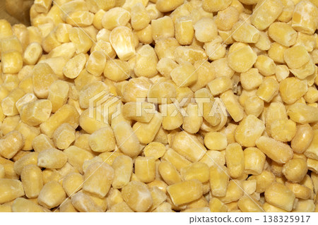 Cose up of frozen sweetcorn corn kernels yellow seeds background Cose up of frozen sweetcorn corn kernels yellow seeds background 138325917