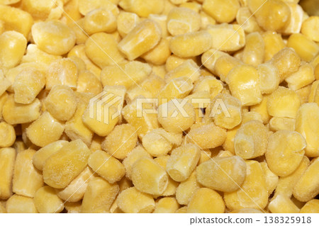 Cose up of frozen sweetcorn corn kernels yellow seeds background Cose up of frozen sweetcorn corn kernels yellow seeds background 138325918