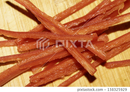 Close up of chopped chili salad vegetables on a wooden chopping board Close up of chopped chili salad vegetables on a wooden chopping board 138325929