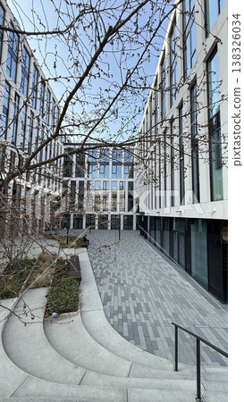 Modern courtyard in Prague with clear blue sky and trees in early spring 138326034