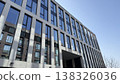 Walking by a modern building in Prague on a clear day with blue sky 138326036