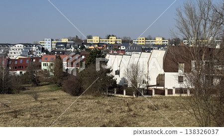 View of residential area in Prague with buildings under clear sky and trees in spring season 138326037