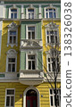 Colorful building in Prague with yellow and green facade standing on a sunny day in a quiet street 138326038