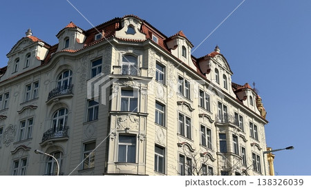 Building in Prague with classic architecture and clear blue sky at midday Building in Prague with classic architecture and clear blue sky at midday 138326039