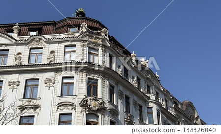 Exploring the architectural details of a historic building in Prague on a sunny day Exploring the architectural details of a historic building in Prague on a sunny day 138326040