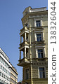Tall building with balcony viewed from street in Prague during bright daylight 138326044