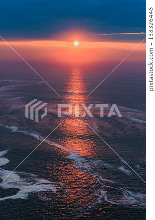 Sunrise at Cape Chikyu, Hokkaido: The beautiful light of the rising sun reflected on the surface of the sea. Sunrise at Cape Chikyu, Hokkaido: The beautiful light of the rising sun reflected on the surface of the sea. 138326446