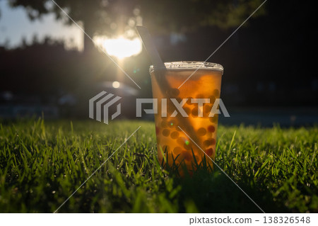 Boba tea drink on grass in golden hour Boba tea drink on grass in golden hour 138326548