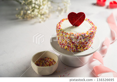 Valentine's Day, Love, festive cake with red heart and gypsophila flowers Valentine's Day, Love, festive cake with red heart and gypsophila flowers 138326695