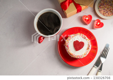 Valentine's Day or Mother's Day bento cake with red heart, cup of coffee and candles. Copy space Valentine's Day or Mother's Day bento cake with red heart, cup of coffee and candles. Copy space 138326708