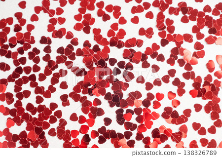 Hearts sequins on a white background, flat lay top view Hearts sequins on a white background, flat lay top view 138326789