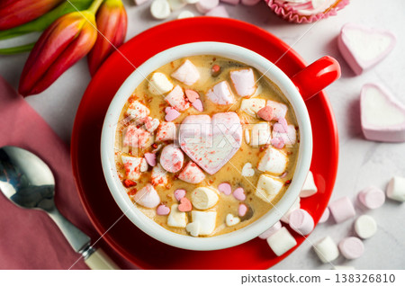 Valentine's Day background. Red cup of coffee with heart shaped marshmallows and ret tulips 138326810