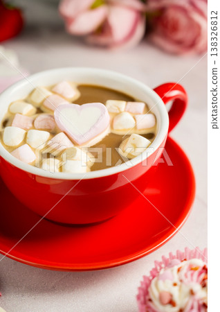 Valentine's Day background. Red cup of coffee with heart shaped marshmallows and ret tulips 138326812