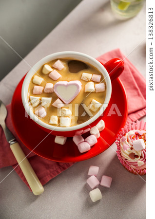 Valentine's Day background. Red cup of coffee with heart shaped marshmallows and ret tulips 138326813