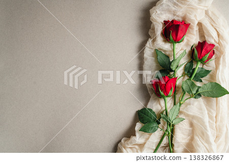 Mother's Day or Valentine's Day background. Red rose flower on neutral background. Greeting card template, copy space Mother's Day or Valentine's Day background. Red rose flower on neutral background. Greeting card template, copy space 138326867