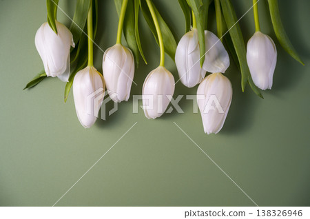 Spring easter background. Bouquet of white tulip flowers over green background, copy space 138326946