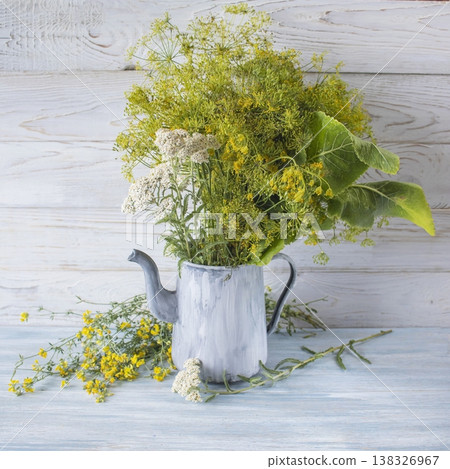 Summer still life with fresh dill, rudbeckia and tomatoes in an old jug. Rustic still life with yellow flowers and greenery on a wooden table. Summer still life with fresh dill, rudbeckia and tomatoes in an old jug. Rustic still life with yellow flowers and greenery on a wooden table. 138326967