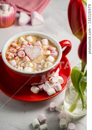 Valentine's Day background. Red cup of coffee with heart shaped marshmallows and ret tulips 138326979