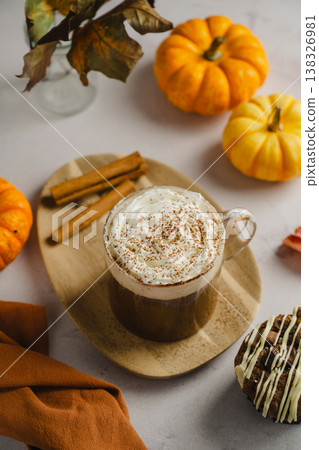 Pumpkin spice latte in glass mug with whipped cream and cinnamon, autumn hot drink Pumpkin spice latte in glass mug with whipped cream and cinnamon, autumn hot drink 138326981