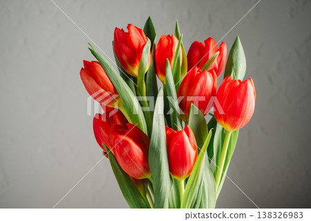 Spring flowers background. A bouquet of fresh red tulips, birthday or easter background Spring flowers background. A bouquet of fresh red tulips, birthday or easter background 138326983