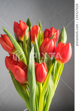 Spring flowers background. A bouquet of fresh red tulips, birthday or easter background 138327026