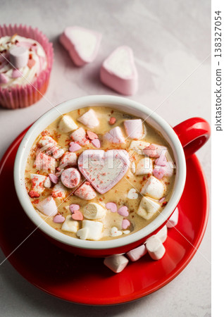 Valentine's Day background. Red cup of coffee with heart shaped marshmallows and ret tulips 138327054