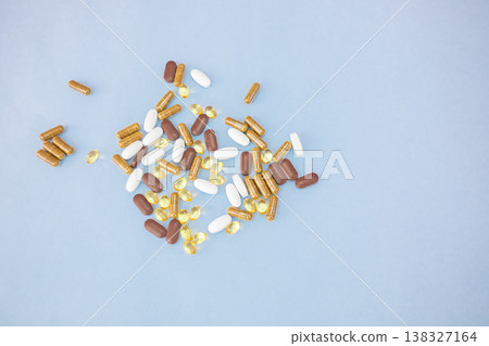 Assortment of Vitamins and Minerals on blue background 138327164