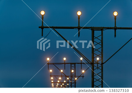 Airport approach lighting system at dusk 138327310
