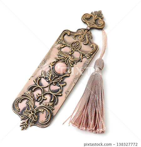 Elegant metal bookmark with ornate antique gold scrollwork and pink tassel Elegant metal bookmark with ornate antique gold scrollwork and pink tassel 138327772