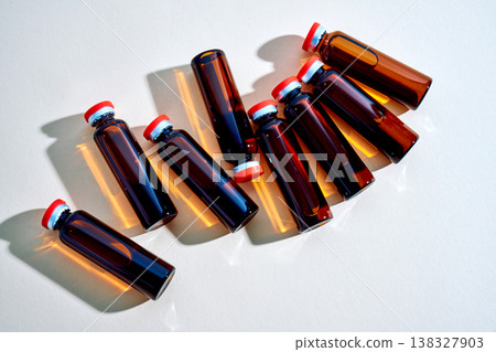 Vials containing amber liquid for medical research and treatment Vials containing amber liquid for medical research and treatment 138327903