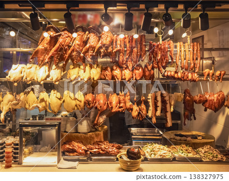 Chinese street food. Golden roasted meats hang neatly on racks Chinese street food. Golden roasted meats hang neatly on racks 138327975