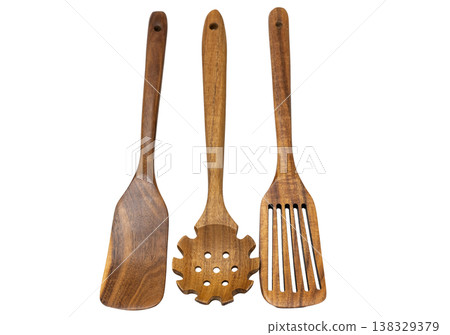 wooden kitchen spoons isolated on a white background wooden kitchen spoons isolated on a white background 138329379
